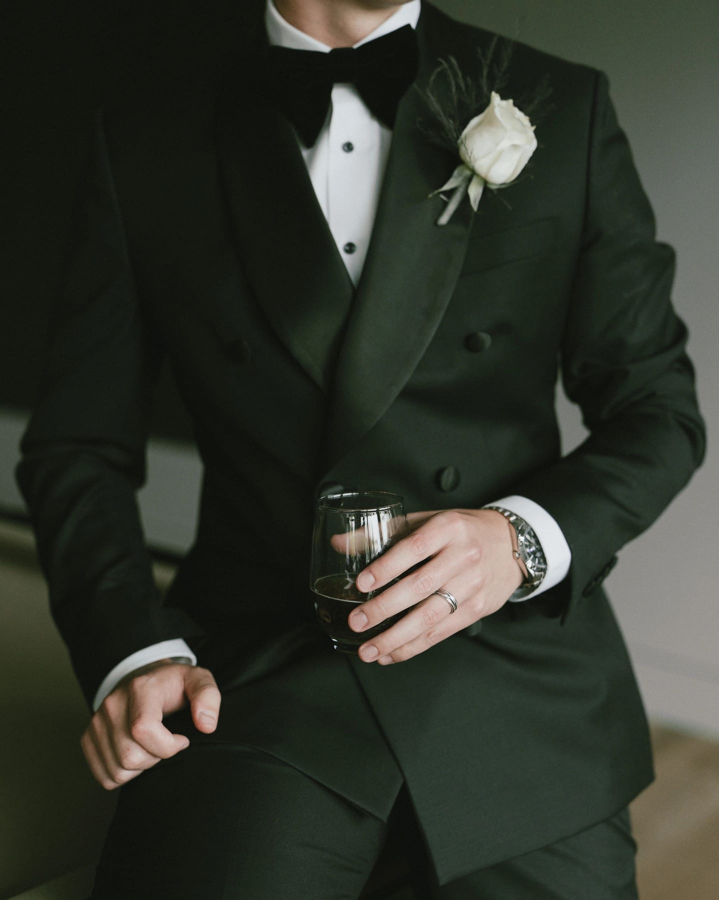 A Conxeppt groom in a custom green tuxedo